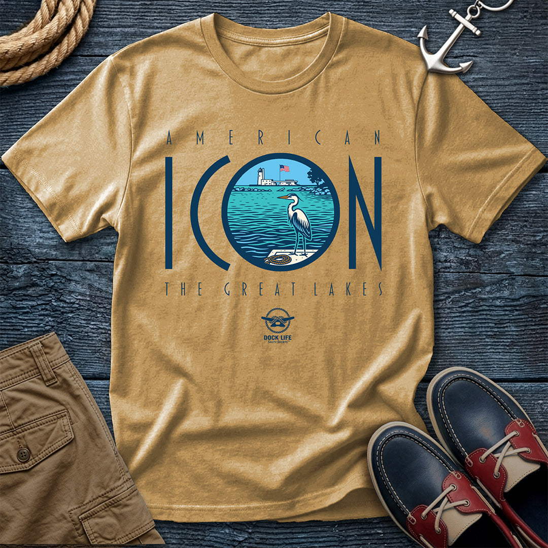 Mustard Colored t-shirt with 'American Icon The Great Lakes' design on a wooden surface with shorts and shoes.