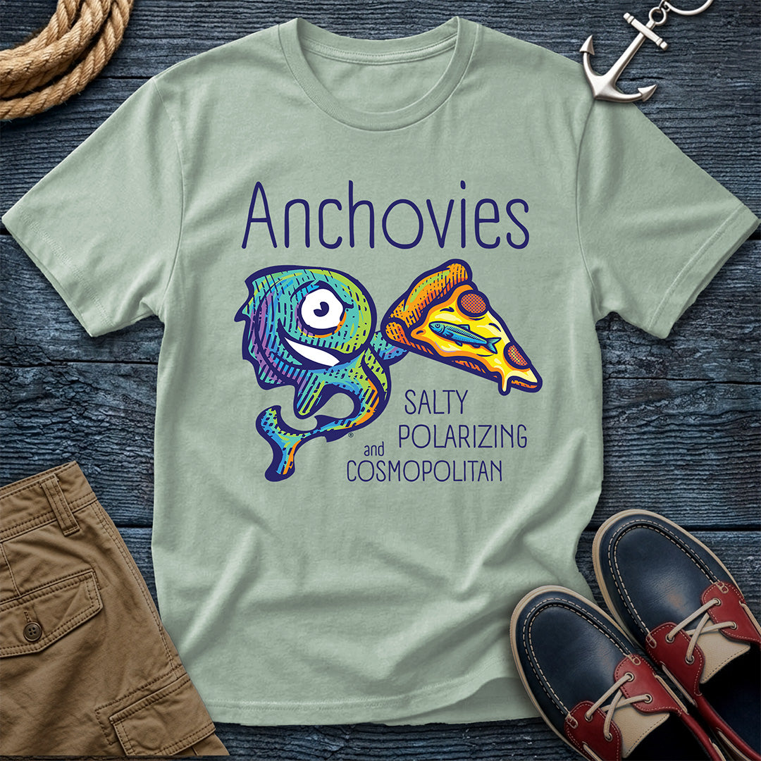 A Bay colored short-sleeve crewneck t-shirt featuring a colorful graphic of Salty the anchovy mascot diving into a pizza slice, with the text 'Anchovies SALTY POLARIZING and COSMOPOLITAN' printed on the front.