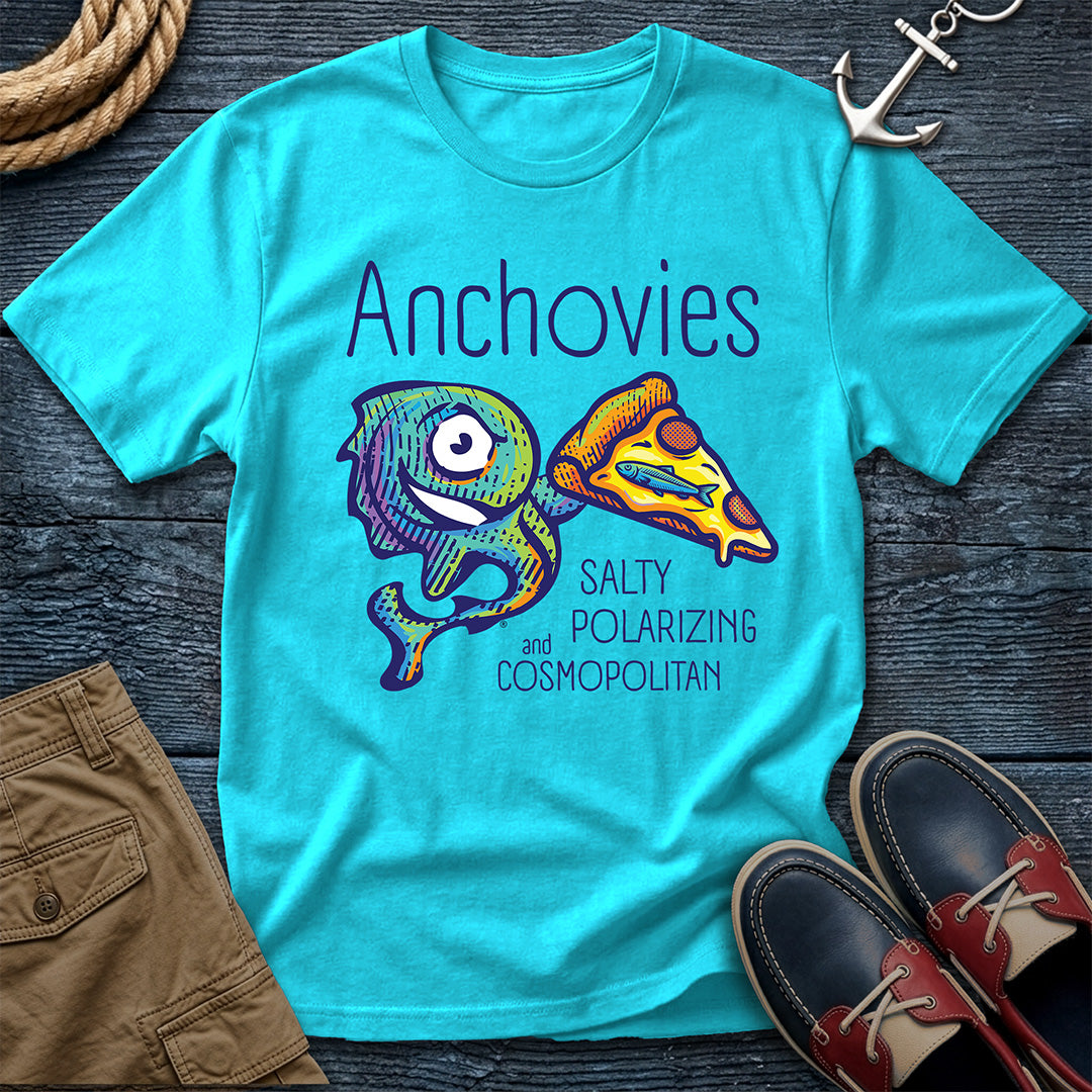 A Lagoon Blue short-sleeve crewneck t-shirt featuring a colorful graphic of Salty the anchovy mascot diving into a pizza slice, with the text 'Anchovies SALTY POLARIZING and COSMOPOLITAN' printed on the front.