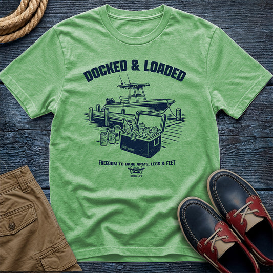 Docked Loaded Mint green t-shirt with a graphic design on a wooden surface