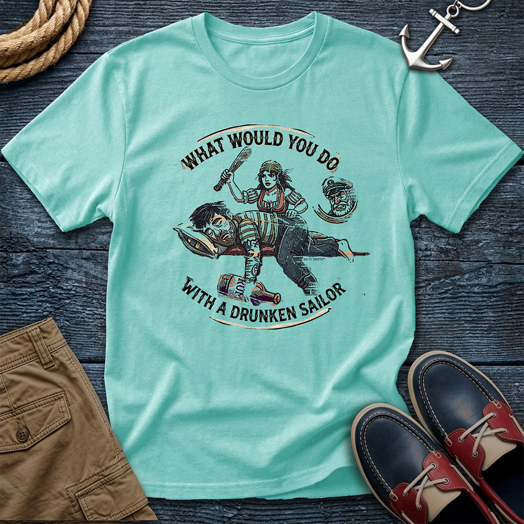 Drunken Sailor Shanty Tee in Chalky Mint: flat lay of a Comfort Colors 1717 tee on dark weathered wood with rope, an anchor keychain, khaki pants, and boat shoes. Distressed woodcut print shows a woman with a club swinging at a passed-out drunken sailor holding a rum bottle, framed by the text "What Would You Do With a Drunken Sailor."