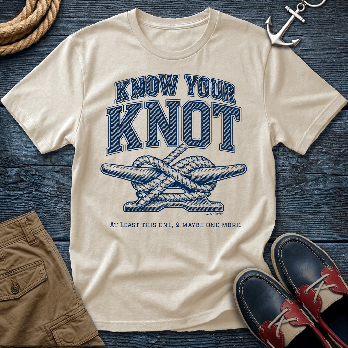 Ivory t-shirt with 'Know Your Knot' graphic on a wooden surface with shoes and rope.