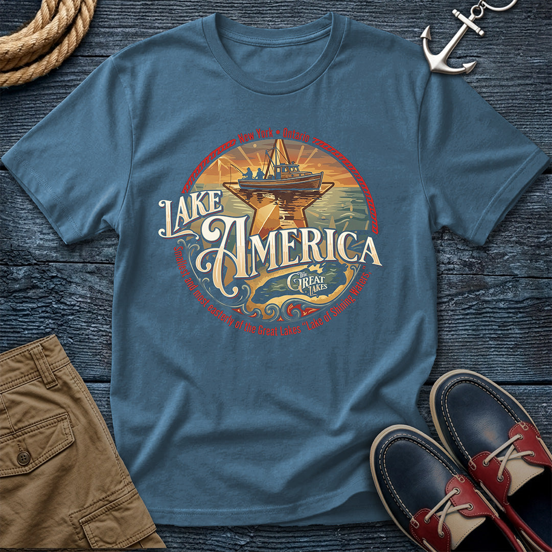 "Lake America Crest Tee in Denim — vintage Great Lakes graphic tee with wooden fishing boat and Lake Ontario crest design on Comfort Colors 1717"