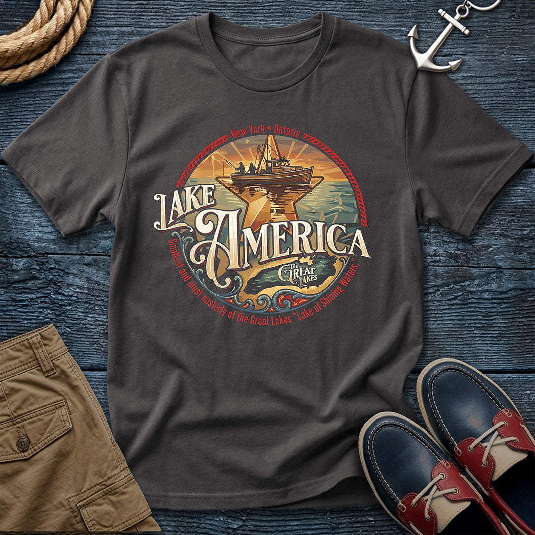 "Lake America Crest Tee in Graphite — vintage Great Lakes graphic tee with wooden fishing boat and Lake Ontario crest design on Comfort Colors 1717"