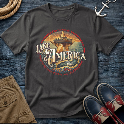 "Lake America Crest Tee in Graphite — vintage Great Lakes graphic tee with wooden fishing boat and Lake Ontario crest design on Comfort Colors 1717"