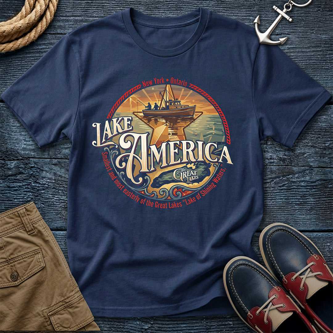 "Lake America Crest Tee in True Navy — vintage Great Lakes graphic tee with wooden fishing boat and Lake Ontario crest design on Comfort Colors 1717"