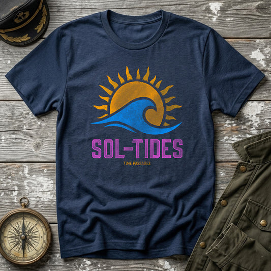 Navy blue t-shirt with 'SOL-TIDES' design on a wooden surface with a hat, compass, and jacket.