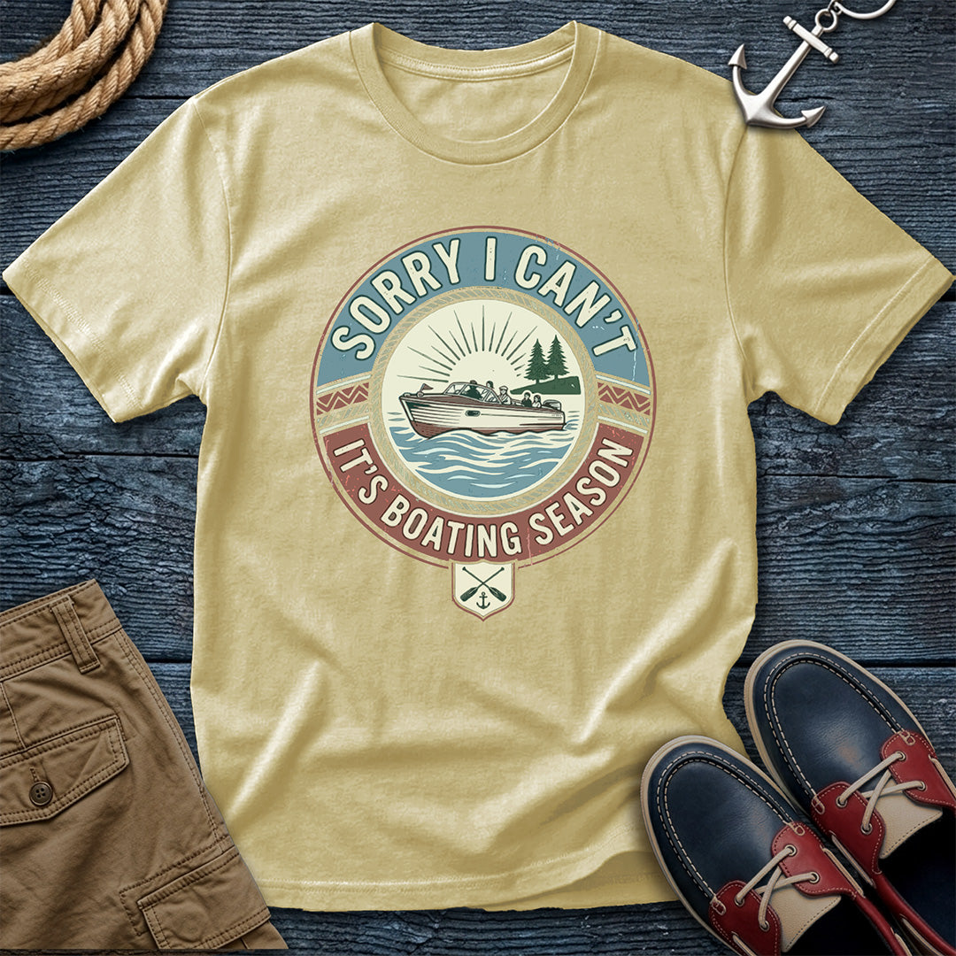 Banana t-shirt with boating season graphic on a wooden surface with shorts and shoes.