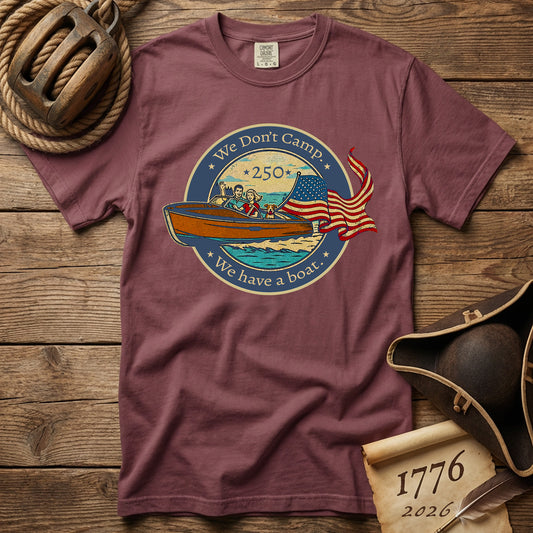 Brick t-shirt with a boat and US flag graphic design on a wooden surface with nautical items.